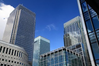 蓝色建筑都市仰拍高楼大厦宣传背景图片